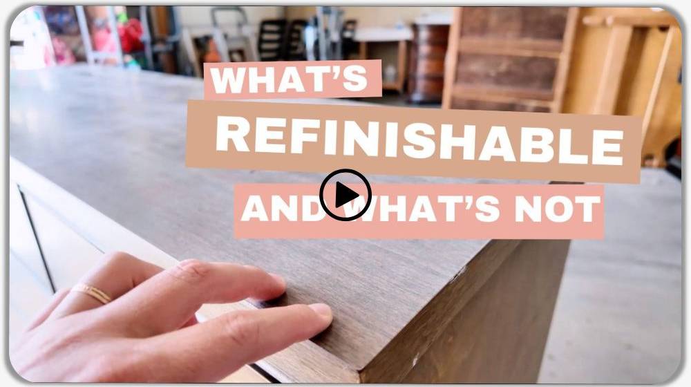 hand touching wood top